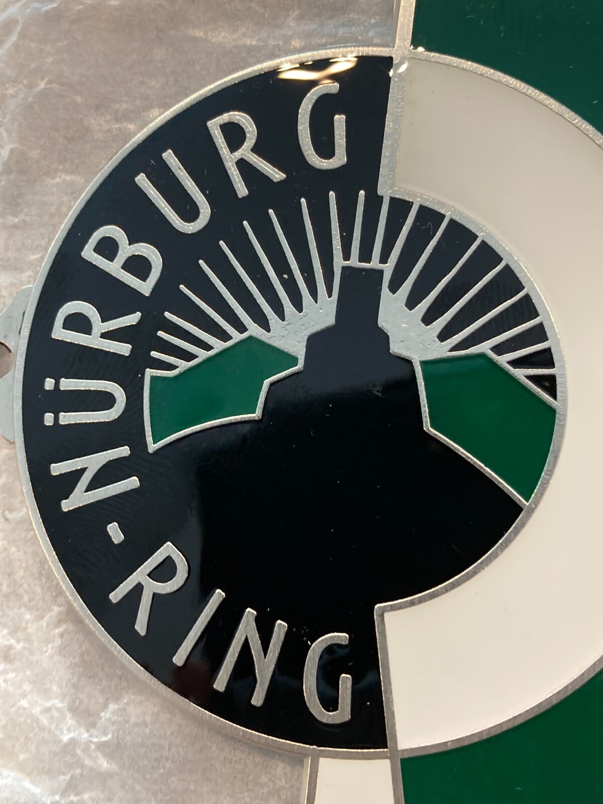 REPRODUCTION GERMAN NURBURG-RING (NURBURGRING) ENAMEL GRILL BADGE W/HARDWARE.