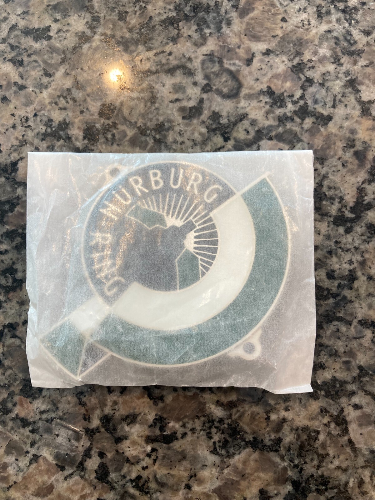 REPRODUCTION GERMAN NURBURG-RING (NURBURGRING) ENAMEL GRILL BADGE W/HARDWARE.