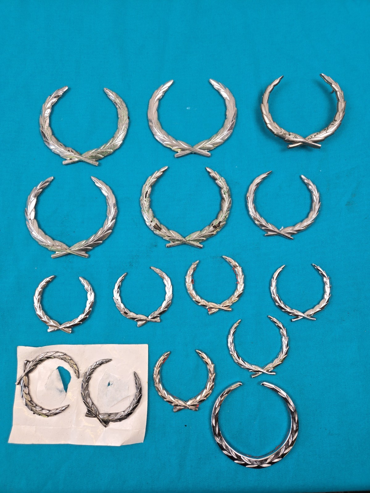 Lot of 15 Original Cadillac Wreath Crest Emblems OEM Trim Metal & Plastic…