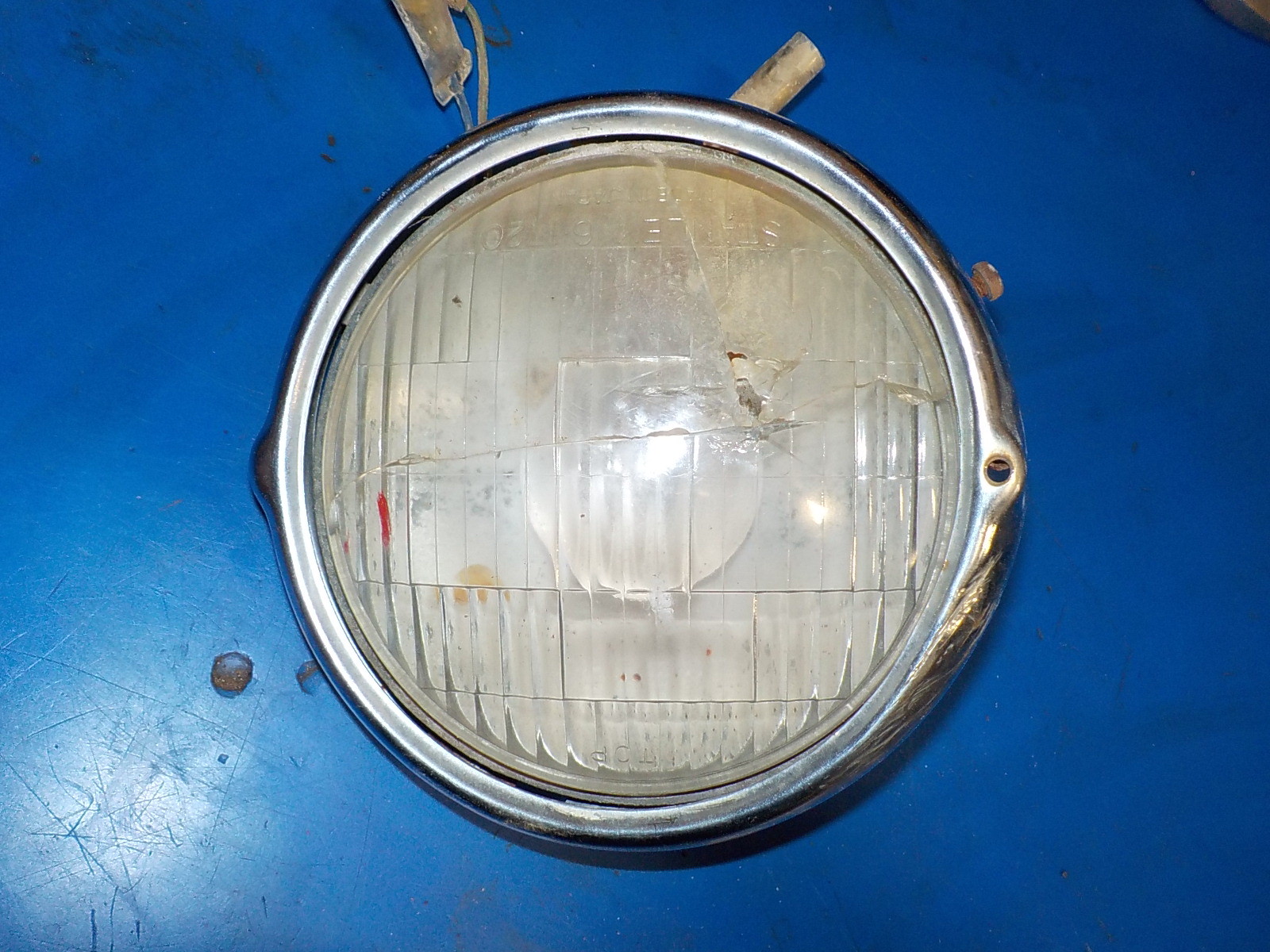 HONDA XL 125 1974 HEADLIGHT / BEZEL DAMAGE AS SHOWN IN PICTURES , USED