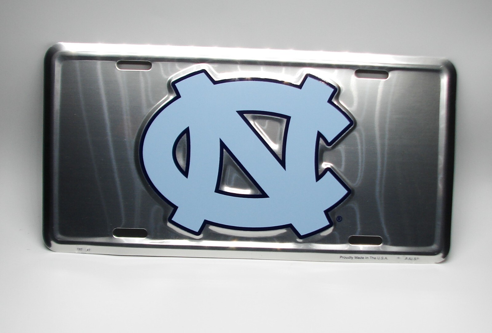 Licensed UNC NORTH CAROLINA TAR HEELS EMBOSSED METAL NOVELTY LICENSE PLATE