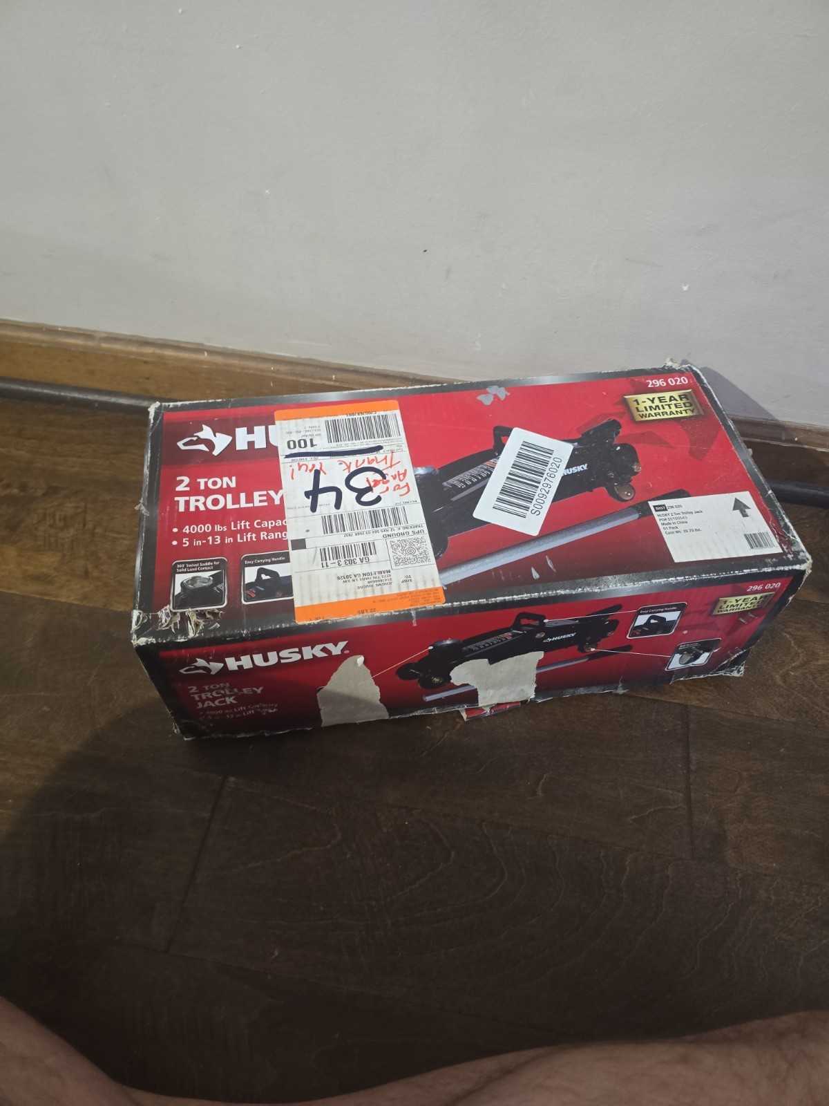 Husky 2-Ton Hydraulic Trolley Floor Jack, lifting range of 5 in. to 13 in.