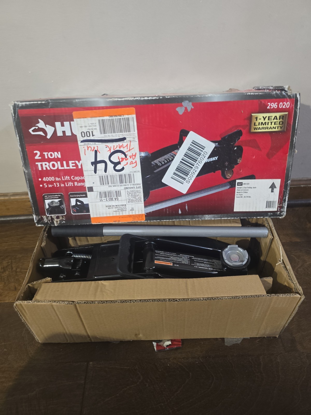 Husky 2-Ton Hydraulic Trolley Floor Jack, lifting range of 5 in. to 13 in.