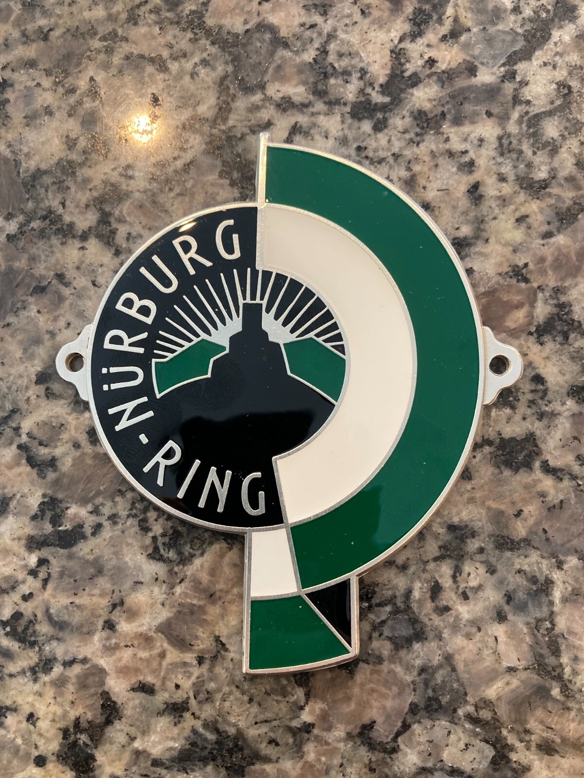 REPRODUCTION GERMAN NURBURG-RING (NURBURGRING) ENAMEL GRILL BADGE W/HARDWARE.