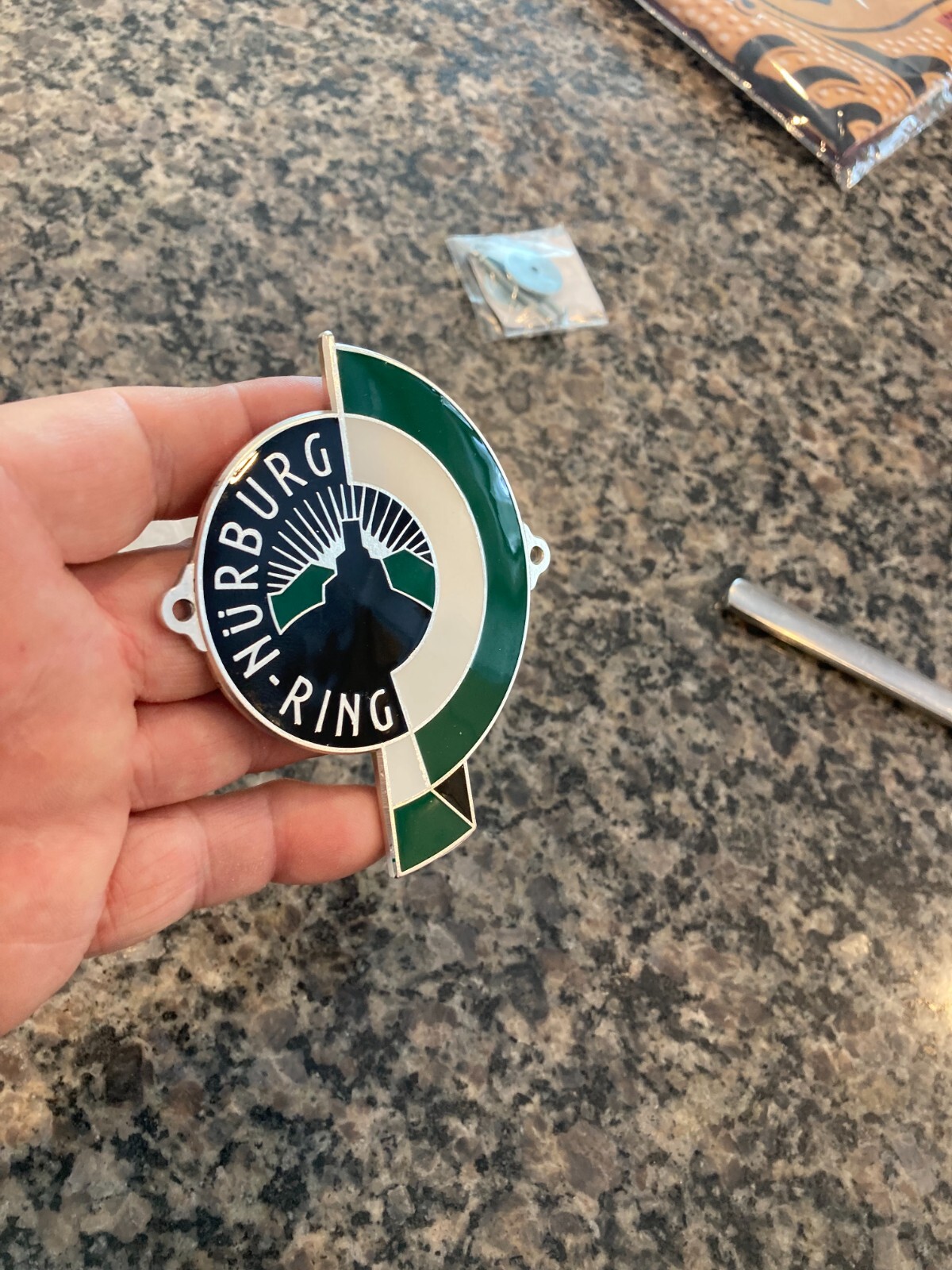 REPRODUCTION GERMAN NURBURG-RING (NURBURGRING) ENAMEL GRILL BADGE W/HARDWARE.