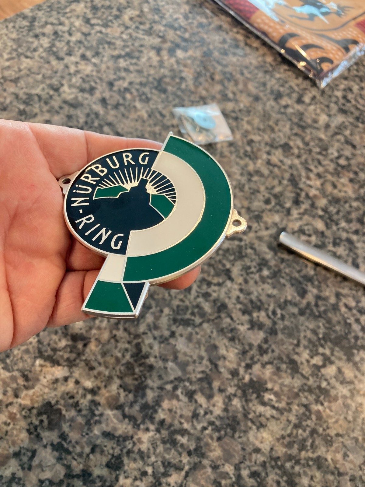 REPRODUCTION GERMAN NURBURG-RING (NURBURGRING) ENAMEL GRILL BADGE W/HARDWARE.